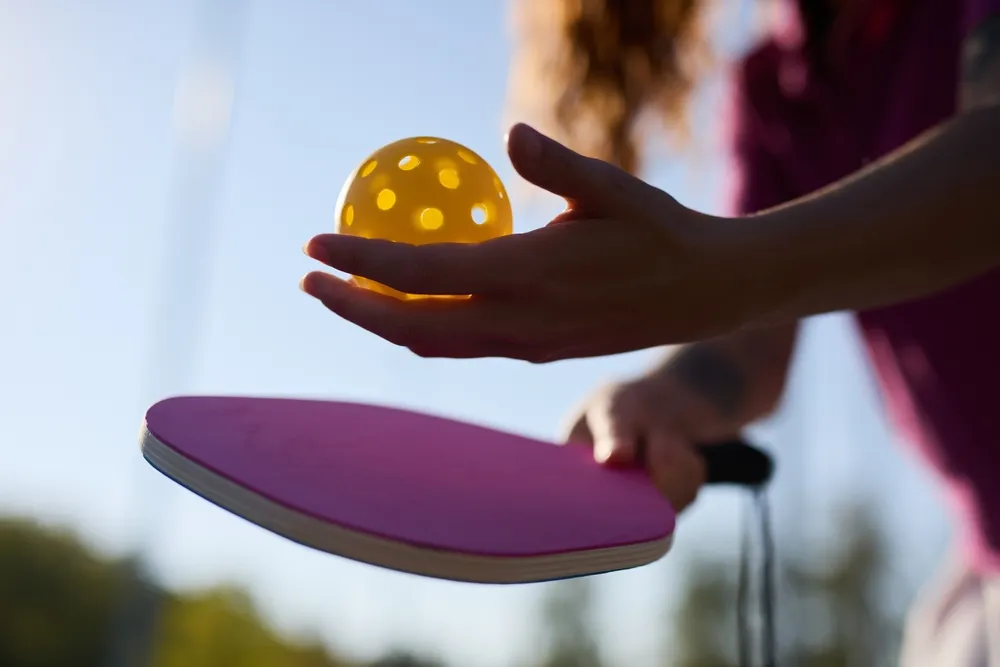 person serving in pickleball