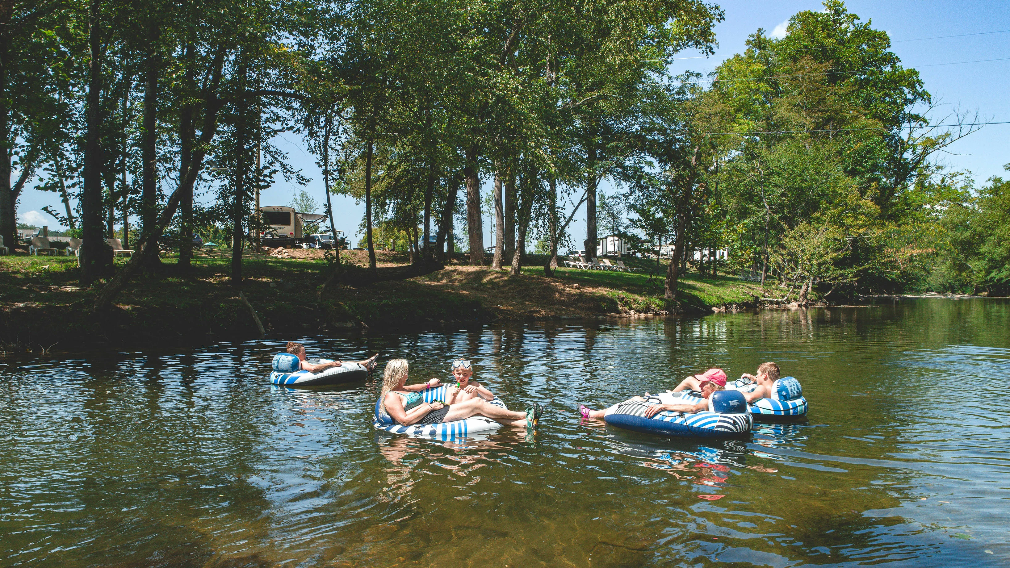 people tubing in a river